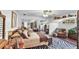 Spacious bedroom featuring zebra rug, mirrored sliding door closet, and sitting area at 1 Crooked Bridge Way, Ormond Beach, FL 32174