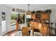Bright breakfast nook with wood table, lots of light from window and wood hutch at 1 Crooked Bridge Way, Ormond Beach, FL 32174