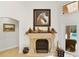 Elegant fireplace with intricate details and view of the outside pool at 1 Crooked Bridge Way, Ormond Beach, FL 32174