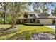 Charming two-story home with a well-kept lawn, a neatly landscaped garden, and a two-car garage at 1 Crooked Bridge Way, Ormond Beach, FL 32174