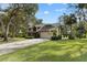 Lovely two-story home boasting a manicured lawn, mature trees, and an attached two-car garage at 1 Crooked Bridge Way, Ormond Beach, FL 32174