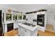 Spacious kitchen with white cabinets, granite countertops, and stainless-steel appliances at 1 Crooked Bridge Way, Ormond Beach, FL 32174
