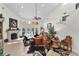 Spacious living room boasts high ceilings, natural light, and a cozy seating arrangement at 1 Crooked Bridge Way, Ormond Beach, FL 32174