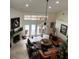 Bright living room with high ceilings, fireplace, a ceiling fan and natural light at 1 Crooked Bridge Way, Ormond Beach, FL 32174