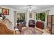 Bright office with a window and desk, chair, exercise bike and a decorative rug at 1 Crooked Bridge Way, Ormond Beach, FL 32174