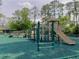 Community playground featuring slides, bridges, and climbing structures at 1 Crooked Bridge Way, Ormond Beach, FL 32174