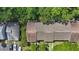 Aerial view of home's roof, landscaping, and surrounding area at 1502 Deer Springs Rd, Port Orange, FL 32129