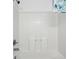 Bathroom with white tiled shower and stainless steel fixtures at 1502 Deer Springs Rd, Port Orange, FL 32129
