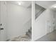 Bright entryway features stylish tile flooring transitioning to carpeted stairs, leading to the upper level at 1502 Deer Springs Rd, Port Orange, FL 32129