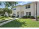 Well-maintained home with manicured lawn, mature trees, and sidewalks at 1502 Deer Springs Rd, Port Orange, FL 32129