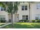 Inviting townhome facade, showcasing a well-kept lawn, tasteful landscaping, and an appealing entryway at 1502 Deer Springs Rd, Port Orange, FL 32129