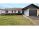 Charming one-story home with a well-maintained front yard and a one car garage at 1744 Valencia Ave, Ormond Beach, FL 32174