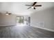 Open-concept living area with hardwood floors, stainless steel appliances, and lots of natural light at 1744 Valencia Ave, Ormond Beach, FL 32174