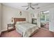 Relaxing bedroom with comfortable queen-size bed, and mirrored closet doors at 1766 Roscoe Turner Trl, Port Orange, FL 32128