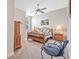 Bright bedroom with wooden furniture, a ceiling fan, and neutral colored carpet at 1766 Roscoe Turner Trl, Port Orange, FL 32128