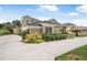 Charming home exterior with a well-manicured lawn and lush landscaping at 1766 Roscoe Turner Trl, Port Orange, FL 32128