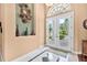 Inviting foyer with decorative details and an elegant front door at 1766 Roscoe Turner Trl, Port Orange, FL 32128