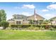 Beautiful two-story home featuring a manicured lawn and decorative shrubbery at 1766 Roscoe Turner Trl, Port Orange, FL 32128
