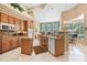 Spacious kitchen with wood cabinets, stainless steel appliances, and an open design at 1766 Roscoe Turner Trl, Port Orange, FL 32128