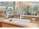 Close up of kitchen sink overlooking the lanai and pool at 1766 Roscoe Turner Trl, Port Orange, FL 32128