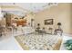 Large, bright living room featuring a decorative rug and views into other living spaces at 1766 Roscoe Turner Trl, Port Orange, FL 32128