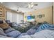 Expansive living area with comfortable seating, a fireplace, and a large television at 1766 Roscoe Turner Trl, Port Orange, FL 32128