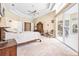 Airy main bedroom featuring high ceilings and access to the pool area at 1766 Roscoe Turner Trl, Port Orange, FL 32128