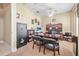 Spacious home office with large wooden desk, rolling leather chairs and a gun safe at 1766 Roscoe Turner Trl, Port Orange, FL 32128