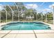 Spacious pool with integrated spa surrounded by a screened enclosure at 1766 Roscoe Turner Trl, Port Orange, FL 32128