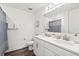 Bathroom featuring a double vanity, large mirror, and a shower with a blue patterned curtain at 3828 S Atlantic Ave, Daytona Beach, FL 32118