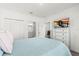 Bright bedroom features a television, walk-in closet, and ensuite bathroom at 3828 S Atlantic Ave, Daytona Beach, FL 32118