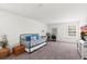 Open concept bonus room with a comfortable bed and dedicated office space at 3828 S Atlantic Ave, Daytona Beach, FL 32118
