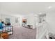 Bonus room with comfortable seating, desk, and views from the second floor at 3828 S Atlantic Ave, Daytona Beach, FL 32118