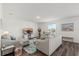 Cozy living room with comfortable seating, a large window, and stylish decor at 3828 S Atlantic Ave, Daytona Beach, FL 32118