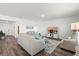 Spacious living room with modern furnishings, a TV, and hardwood floors at 3828 S Atlantic Ave, Daytona Beach, FL 32118