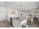 Open-concept layout showcases a seamless flow between kitchen, dining area, and inviting living spaces at 3828 S Atlantic Ave, Daytona Beach, FL 32118