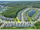 Aerial view of the home within the community near a beautiful lake, highlighting neighborhood layout at 5539 Estero Loop, Port Orange, FL 32128