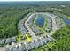 An aerial view showcasing the home's position within the community near a tranquil lake at 5539 Estero Loop, Port Orange, FL 32128