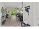Inviting entryway featuring light wood floors and an open floor plan leading to the dining and living areas at 5539 Estero Loop, Port Orange, FL 32128