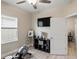 This flex room features light hardwood floors, a large window, and neutral walls at 5539 Estero Loop, Port Orange, FL 32128