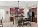 Modern kitchen boasts granite countertops, stainless steel appliances, and a large island with pendant lighting at 5539 Estero Loop, Port Orange, FL 32128