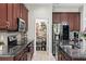 Modern kitchen with stainless steel appliances and a walk-in pantry for ample storage at 5539 Estero Loop, Port Orange, FL 32128