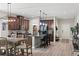 Stylish kitchen with granite countertops, stainless steel appliances, and a cozy breakfast bar with pendant lighting at 5539 Estero Loop, Port Orange, FL 32128
