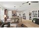 Comfortable living area with hardwood floors, stylish decor, and a seamless flow to the kitchen and laundry room at 5539 Estero Loop, Port Orange, FL 32128