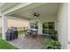 Lovely covered patio with brick pavers, ceiling fan, and outdoor furniture at 5539 Estero Loop, Port Orange, FL 32128