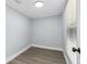 Small bedroom with laminate floors, a window and neutral paint creating a calming space at 603 W Miles St, Deland, FL 32720