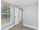 Bright bedroom with a window letting in natural light and a doorway leading to another room at 603 W Miles St, Deland, FL 32720