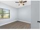 This bedroom offers wood-look flooring and bright natural light at 603 W Miles St, Deland, FL 32720