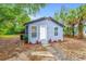 Charming bungalow with blue siding, white trim, and inviting front entrance at 603 W Miles St, Deland, FL 32720