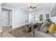 Cozy living room with a gray sectional, view to other rooms, and modern accents at 603 W Miles St, Deland, FL 32720